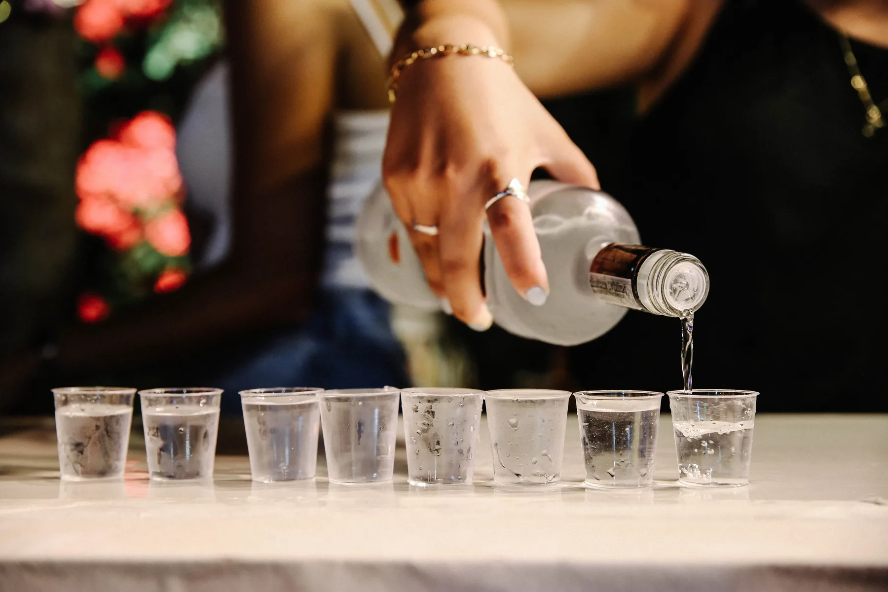 A martini with olives on a sunlit rail, the spirit clear and colourless