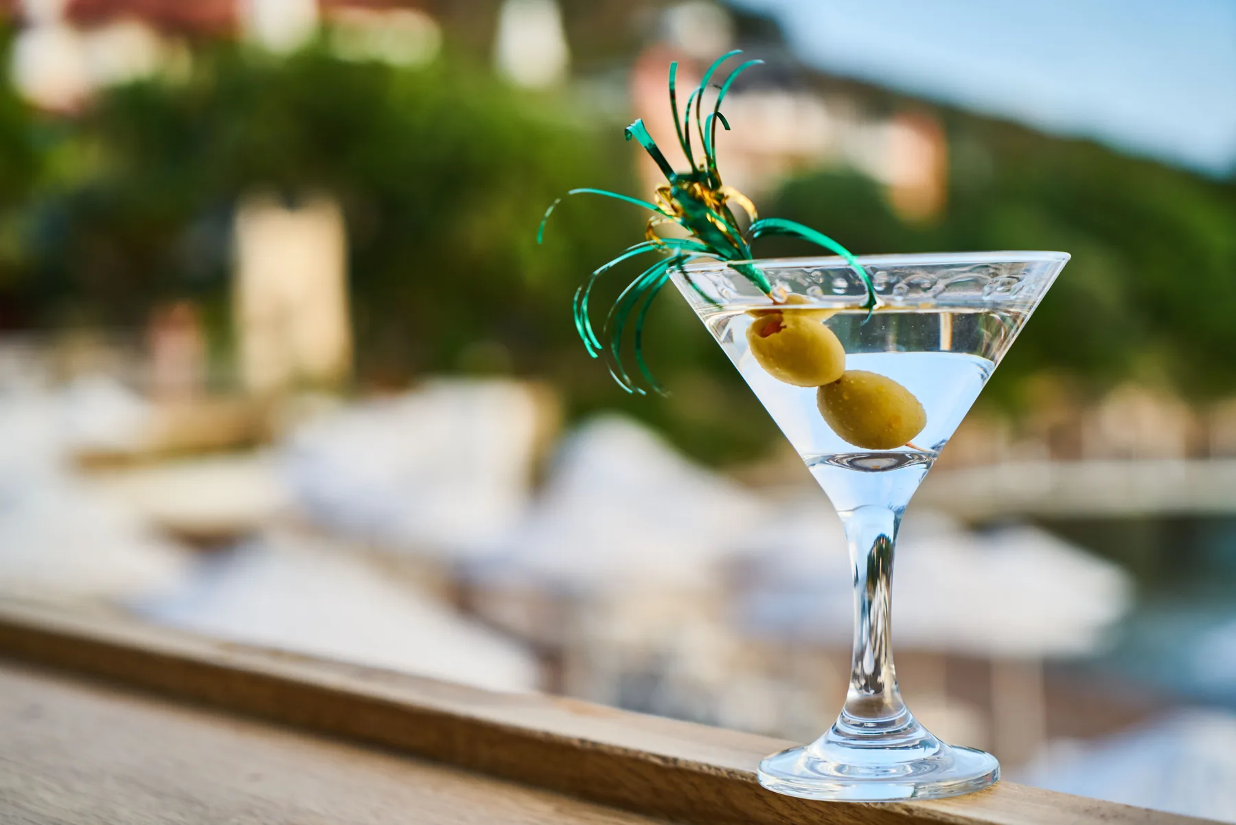 Clear spirit poured into a line of small glasses